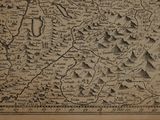 an old map of a mountain range with mountains in the background