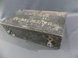 an old suitcase with writing on it sitting on a table