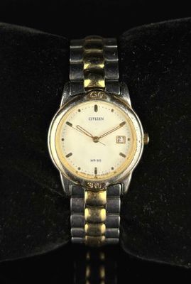 CITIZEN. Montre bracelet en acier et métal doré.