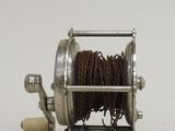 a reel that is sitting on a white surface