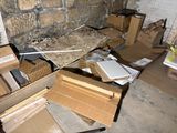 a pile of boxes that are sitting on the floor