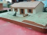 a small model of a house on a table
