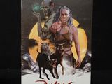 a close up of a box with a picture of a woman and a dog