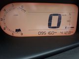 a close up of a car ' s dashboard with a speedometer