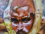 painting of a man with a beard and a headdress on a wall