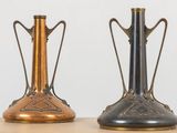 two vases that are sitting on a table