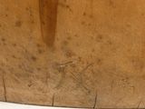 a close up of a wooden bowl on a table