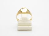 a close up of a gold ring with a star on it