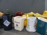 many different types of mugs sitting on a table