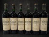 six bottles of wine are lined up in a row on a black background