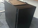a computer case sitting on top of a metal floor