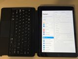 two laptops sitting next to each other on a table