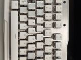 a computer keyboard that has a lot of buttons on it