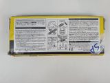 a close up of a box of food on a white surface
