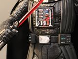 star wars action figure of darth vader holding a darth vader sword