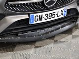 a car that has been damaged and is parked on the street