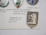 some badges on a piece of paper on a table