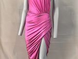 the mannequin is wearing a pink dress with a high neck