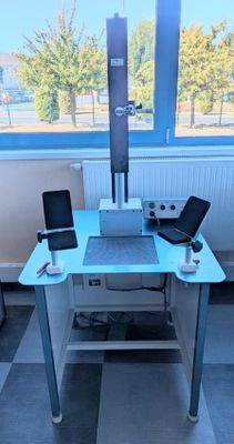 a desk with a laptop and a monitor on it