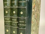 the spines of the books are lined up in a row