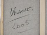 a close up of a drawing of a person ' s name on a piece of fabric