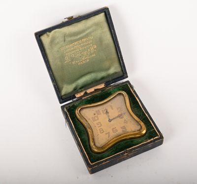 a small box with a clock inside of it