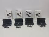 four boxes of earphones are lined up on a white surface
