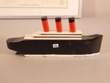 a black and white model of a boat on a table