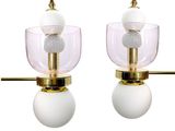 pair of brass and glass table lamps with white globe shades