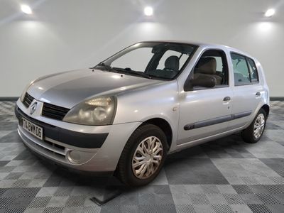 a picture of a silver car parked on a checkered floor