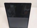 an image of a tablet computer sitting on top of a white table