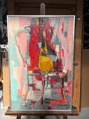 un tableau posé sur un chevalet, représentant une guitare