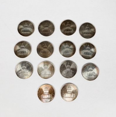 a lot of coins arranged in a circle on a table