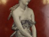 a picture of a woman that is sitting on a plate