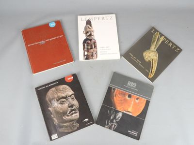 several books are sitting on a table next to each other