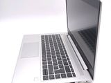 a laptop computer that is sitting on a white surface