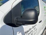 a white van parked on the side of the road