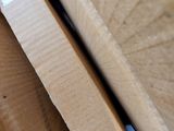 a close up of a piece of wood on a table