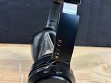 a pair of headphones sitting on top of a wooden table