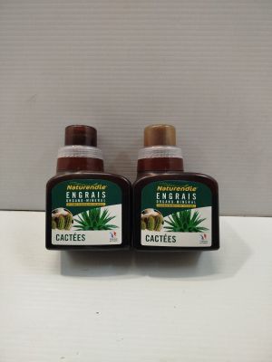 two bottles of aloefes sitting on top of a counter
