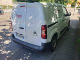 a white van that is parked on the side of the road