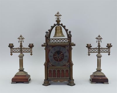 three different types of clocks on display on a table