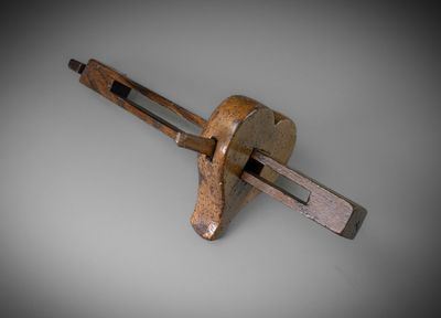 a small wooden tool that is on top of a table