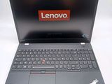 lenovo laptop with a red lenovo sticker on the screen