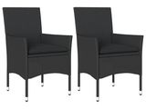 une paire de chaises de salle à manger en osier noir avec des coussins noirs