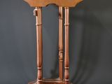 a wooden table with two legs and a small table top