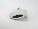 a small silver object on a white surface