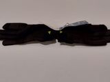 two pairs of black gloves sitting on top of a white table