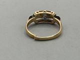 an image of a gold ring with a diamond
