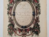 an old book with a picture of a wreath on it